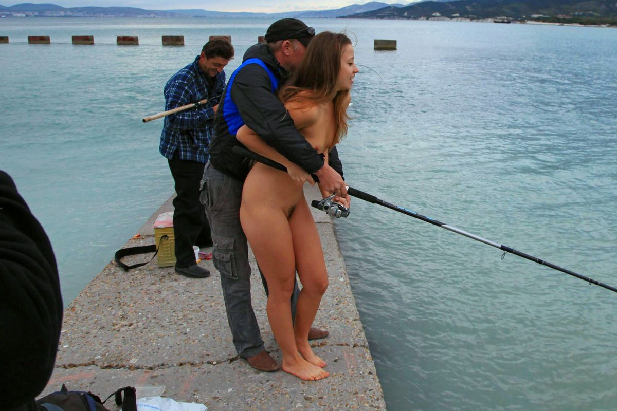 My wife naked and fishing